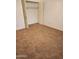 Cozy bedroom with neutral carpet, closet with doors, and good lighting at 7607 N 22Nd Pl, Phoenix, AZ 85020