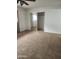 Bedroom featuring neutral carpet, closet with sliding doors, and bright window at 7607 N 22Nd Pl, Phoenix, AZ 85020