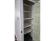 Linen closet with shelving and bi-fold door at 7607 N 22Nd Pl, Phoenix, AZ 85020
