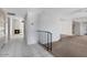 Tiled hallway leading to living spaces, featuring a fireplace and staircase at 7607 N 22Nd Pl, Phoenix, AZ 85020