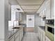 Bright kitchen with granite countertops, white cabinetry, and tile flooring at 7607 N 22Nd Pl, Phoenix, AZ 85020