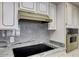 Close up of a kitchen showcasing granite countertops, white cabinetry with gold trim, and stainless steel appliances at 7607 N 22Nd Pl, Phoenix, AZ 85020