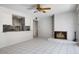 Open-concept living room with a fireplace and adjacent kitchen, perfect for entertaining at 7607 N 22Nd Pl, Phoenix, AZ 85020