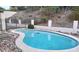 Backyard swimming pool, with stone accents and a secure fence surrounding the pool area at 7607 N 22Nd Pl, Phoenix, AZ 85020