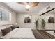 Cozy bedroom featuring a ceiling fan, soft lighting, and mirrored closet at 7777 E Main St # 163, Scottsdale, AZ 85251