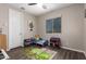 Bright bedroom features a ceiling fan, window, and adorable furnishings at 8430 W Atlantis Way, Tolleson, AZ 85353