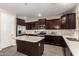 Stylish kitchen with a center island, stainless steel appliances, and ample cabinetry at 8430 W Atlantis Way, Tolleson, AZ 85353