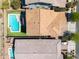 Aerial view of a home with a private pool, a well-maintained yard, and a classic tile roof at 10024 E Tamery Ave, Mesa, AZ 85212