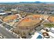 Aerial view of community baseball fields with green grass, well-maintained facilities, and ample parking at 10024 E Tamery Ave, Mesa, AZ 85212