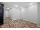 Neutral bedroom featuring wood-look flooring, recessed lighting, and gray walls at 10024 E Tamery Ave, Mesa, AZ 85212