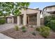 Inviting single-Gathering home featuring a meticulously landscaped front yard and an attached two-car garage at 10024 E Tamery Ave, Mesa, AZ 85212