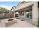 Covered patio featuring a fire pit, providing an ideal outdoor space for relaxation and entertainment at 10024 E Tamery Ave, Mesa, AZ 85212