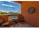 Cozy balcony with seating, offering a view of the surrounding cityscape and blue skies at 1005 E 8Th St # 3017, Tempe, AZ 85281