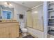 Bright bathroom featuring a vanity, shower with glass doors, and organized shelving at 1005 E 8Th St # 3017, Tempe, AZ 85281