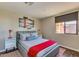 Comfortable bedroom featuring neutral tones, a large window, and a modern bed frame at 1005 E 8Th St # 3017, Tempe, AZ 85281