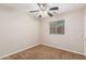 Simple carpeted bedroom featuring a ceiling fan, and natural light from a window at 110 W Yellow Bee Dr, San Tan Valley, AZ 85143