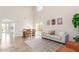 Spacious living room featuring a large window, dining area, tile floors and neutral decor at 110 W Yellow Bee Dr, San Tan Valley, AZ 85143