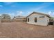 Expansive gravel backyard featuring a covered patio and privacy fencing at 11040 W Hayward Ave, Glendale, AZ 85307