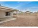 Gravel backyard with covered patio offering ample space for outdoor enjoyment at 11040 W Hayward Ave, Glendale, AZ 85307