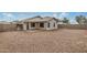 A sprawling gravel backyard featuring a covered patio, providing a tranquil outdoor retreat at 11040 W Hayward Ave, Glendale, AZ 85307