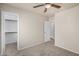 A neutral bedroom with a walk-in closet and doorway to another room at 11040 W Hayward Ave, Glendale, AZ 85307