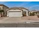 Charming single-story home with a two car garage, desert landscaping, and neutral stucco exterior at 11040 W Hayward Ave, Glendale, AZ 85307