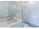 Bathroom with white vanity, quartz counter, white subway tile, toilet and glass shower at 11188 N Blakely St, Surprise, AZ 85388