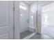 Walk-in shower with white subway tile, bench, and window for natural light at 11188 N Blakely St, Surprise, AZ 85388