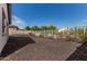 Fenced-in backyard with gravel and low maintenance landscaping at 11915 S 184Th Ave, Goodyear, AZ 85338