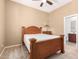 Bedroom with a ceiling fan and a view of the bathroom at 11915 S 184Th Ave, Goodyear, AZ 85338