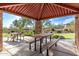 Shaded community picnic area featuring tables and landscaping at 11915 S 184Th Ave, Goodyear, AZ 85338