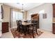 Formal dining room features a table with seating for six beneath a decorative chandelier at 11915 S 184Th Ave, Goodyear, AZ 85338