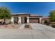 Charming single-story home with a well-manicured yard and a two-car garage at 11915 S 184Th Ave, Goodyear, AZ 85338