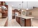 A kitchen area showcases granite counters, stainless steel appliances, and ample cabinet space at 11915 S 184Th Ave, Goodyear, AZ 85338