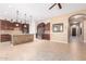 Modern kitchen with stone accent island, stainless steel appliances, and ample counter space at 11915 S 184Th Ave, Goodyear, AZ 85338