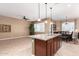 Kitchen island and dining area offer ample space for both food preparation and Gathering time at 11915 S 184Th Ave, Goodyear, AZ 85338