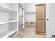 Spacious walk-in closet with built-in shelving and storage at 11915 S 184Th Ave, Goodyear, AZ 85338