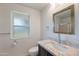 Modern bathroom with granite countertop, and brushed nickel fixtures for a clean and stylish look at 13620 N Hawthorn Dr, Sun City, AZ 85351