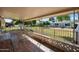 Relaxing covered patio area with outdoor seating overlooking the backyard at 13620 N Hawthorn Dr, Sun City, AZ 85351