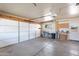 Organized two-car garage with workspace, storage, and ample lighting at 13620 N Hawthorn Dr, Sun City, AZ 85351