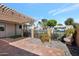 Picturesque patio area with pergola, brick accents, and view of the neighborhood, ideal for outdoor enjoyment at 13620 N Hawthorn Dr, Sun City, AZ 85351