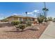 Beautiful home with desert landscaping, a gravel yard, mature cactus, and a well-maintained exterior at 15227 N Rosewood Dr, Sun City, AZ 85351