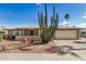 Charming home featuring desert landscaping, gravel yard, mature cactus, and a well-maintained exterior at 15227 N Rosewood Dr, Sun City, AZ 85351