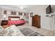 Bright main bedroom with neutral colors, tile floors, and wood furniture at 15227 N Rosewood Dr, Sun City, AZ 85351