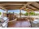 Enjoy outdoor living on this covered patio with tile flooring and a built-in grill at 15227 N Rosewood Dr, Sun City, AZ 85351