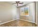 Bedroom with neutral walls, carpet, window with white shutters, and a ceiling fan at 15881 W Berkeley Rd, Goodyear, AZ 85395