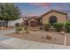 Lovely single-story house featuring desert landscaping, a two-car garage, and a welcoming front entrance at 15881 W Berkeley Rd, Goodyear, AZ 85395