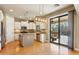 Modern kitchen features white cabinets, stainless steel appliances, and island seating at 15881 W Berkeley Rd, Goodyear, AZ 85395