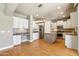 Bright and open kitchen featuring stainless steel appliances, and a view of the living room at 15881 W Berkeley Rd, Goodyear, AZ 85395