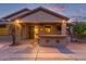 Covered patio with an outdoor bar, providing a great space for relaxation and entertainment at 15881 W Berkeley Rd, Goodyear, AZ 85395